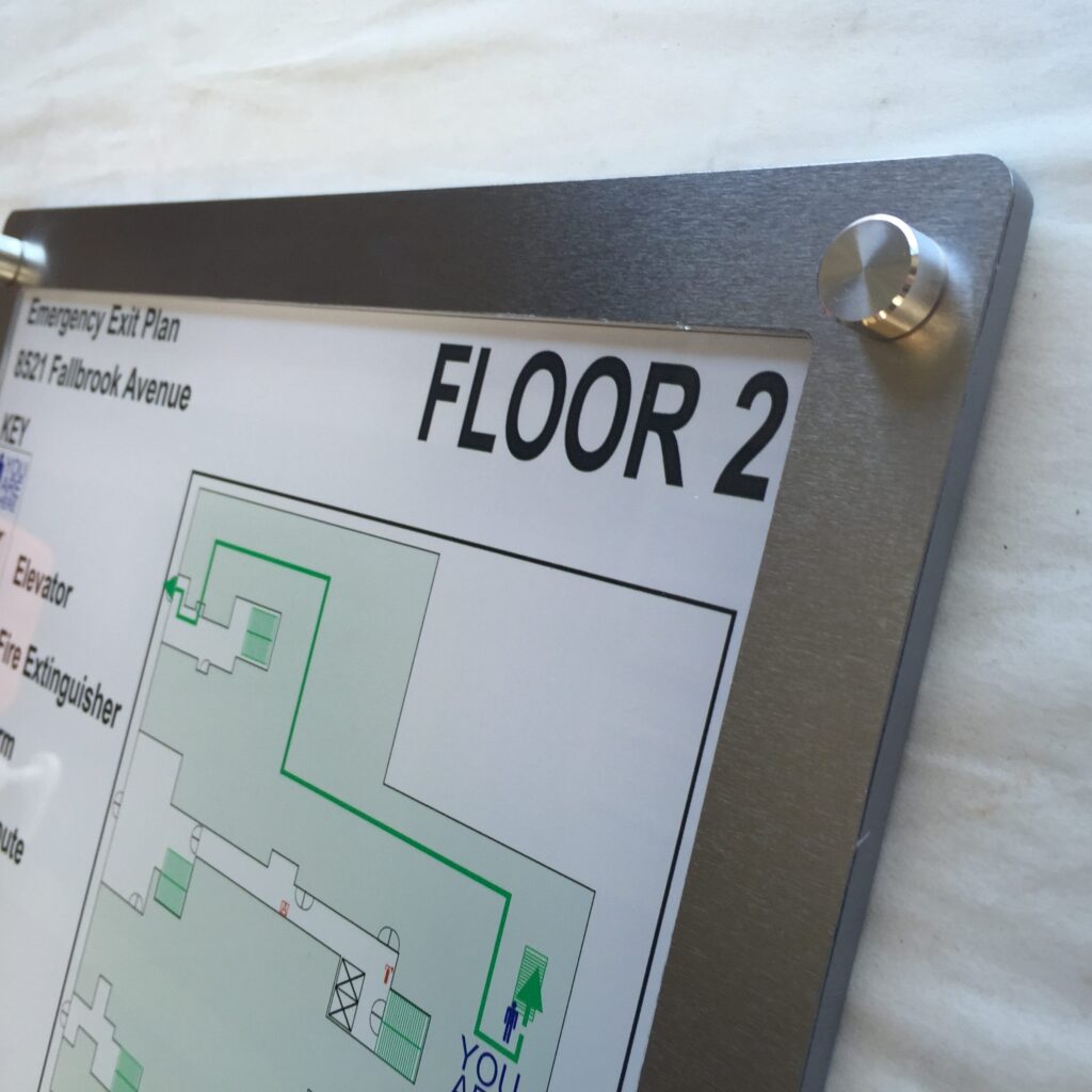 Stainless steel frame with a printed evacuation map by Stanco.