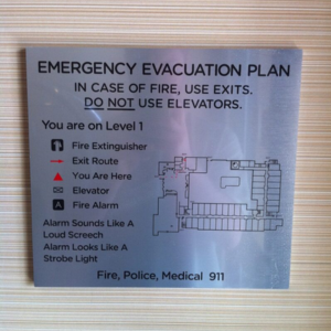 Emergency Wayfinding signage map for a building hallway.