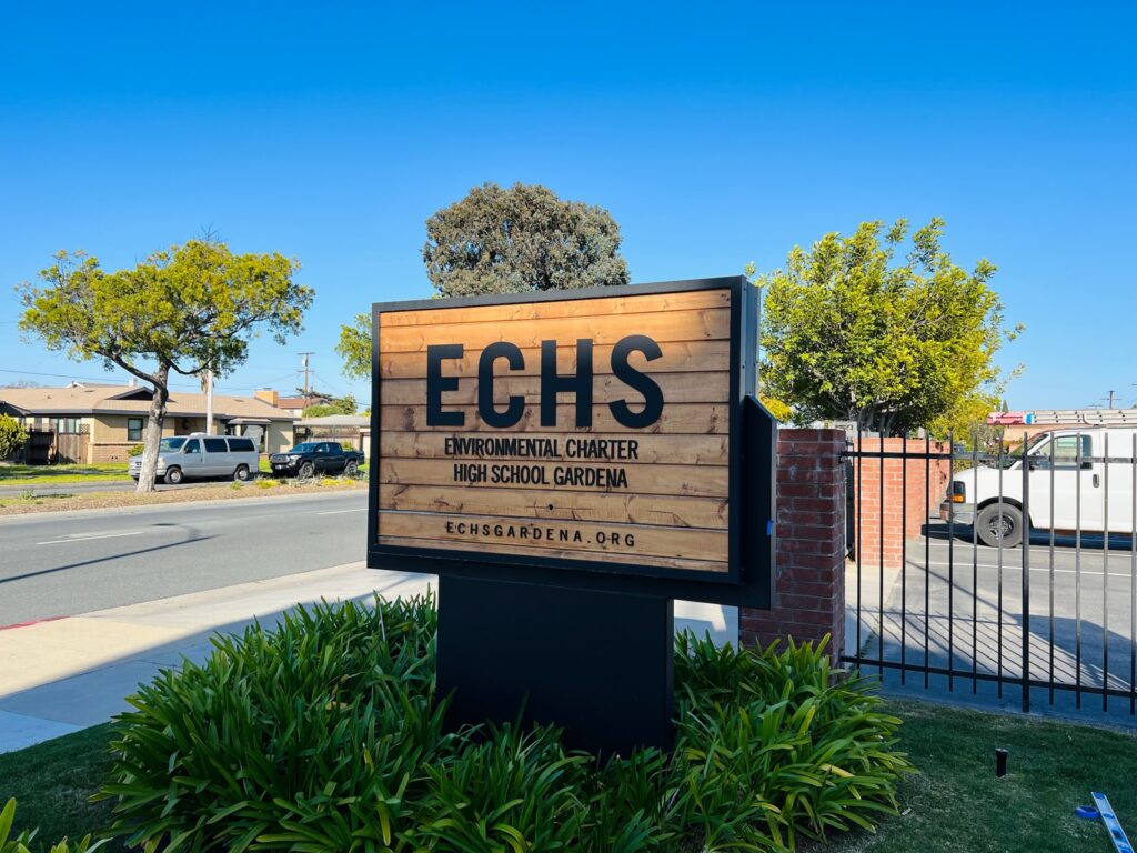 Exterior monument sign with custom millwork and lettering. 