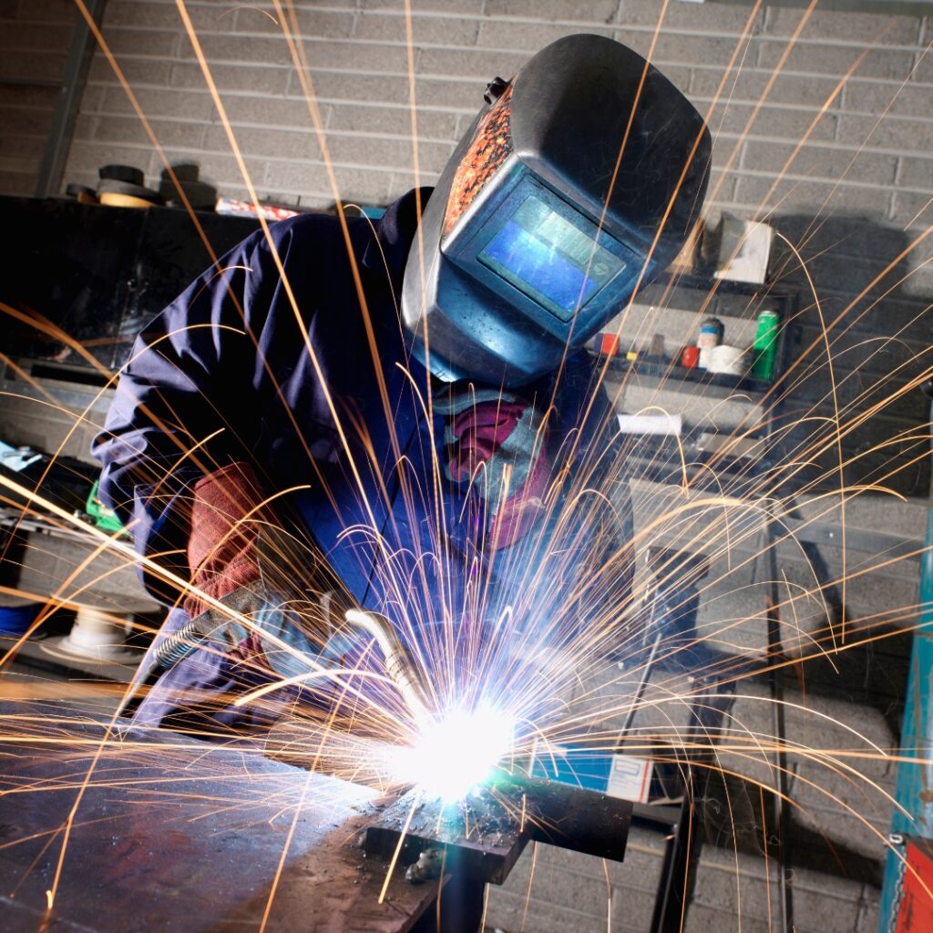 Welding a steel frame for a building sign with channel letters. 